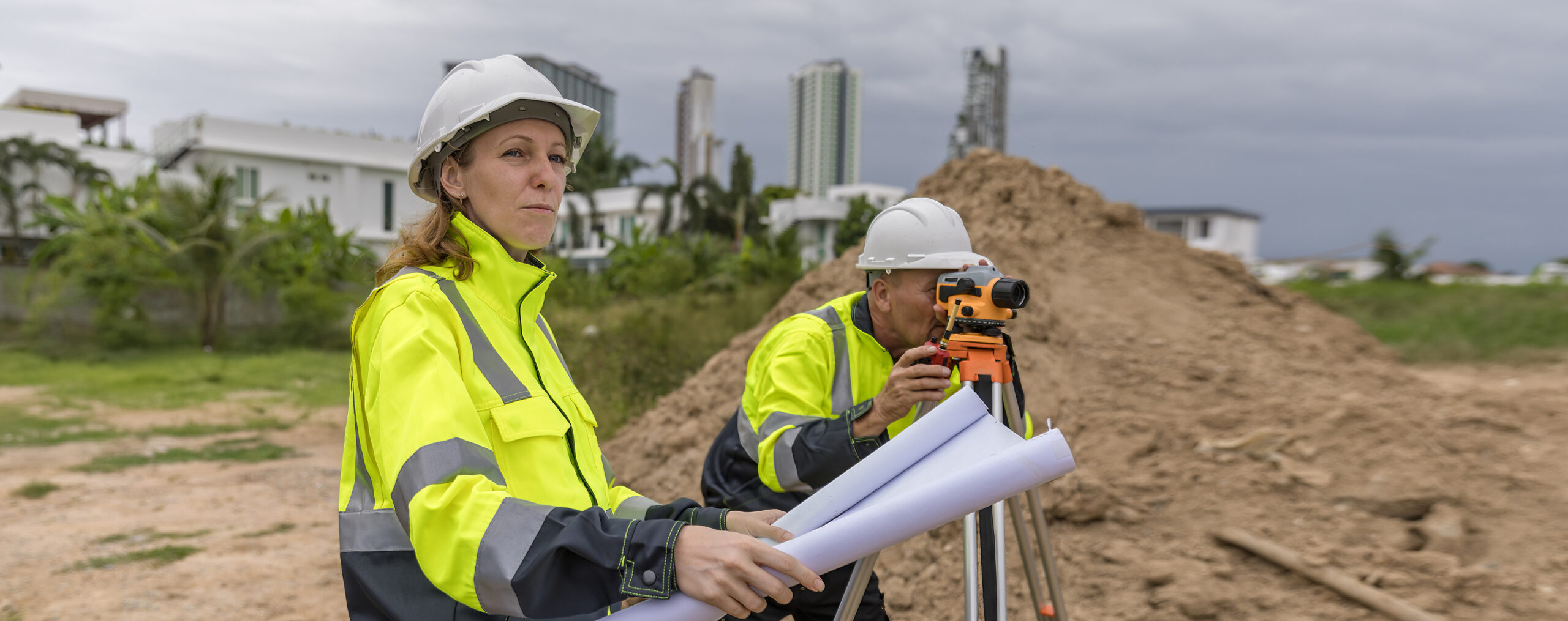Engineer survey team checking construction project  inspection work construction site .Team Civil engineer working outdoor next to the power plant.